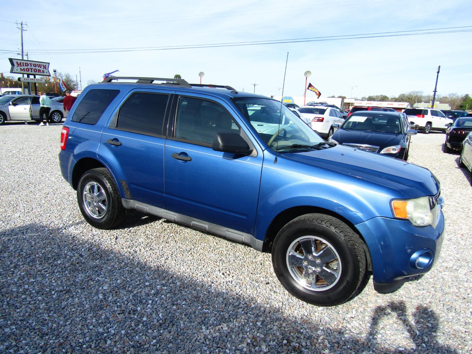 2010 Blue /Black Ford Escape XLT FWD (1FMCU0D72AK) with an 2.5L L4 DOHC 16V engine, Automatic transmission, located at 15016 S Hwy 231, Midland City, AL, 36350, (334) 983-3001, 31.306210, -85.495277 - Photo #0